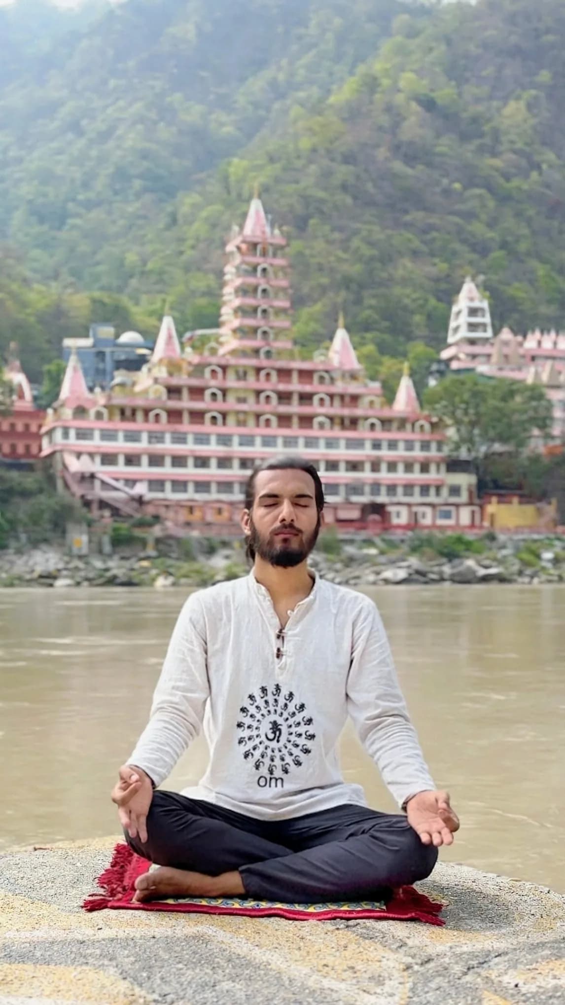 Meditation at dawn on the banks of the Ganges in Rishikesh