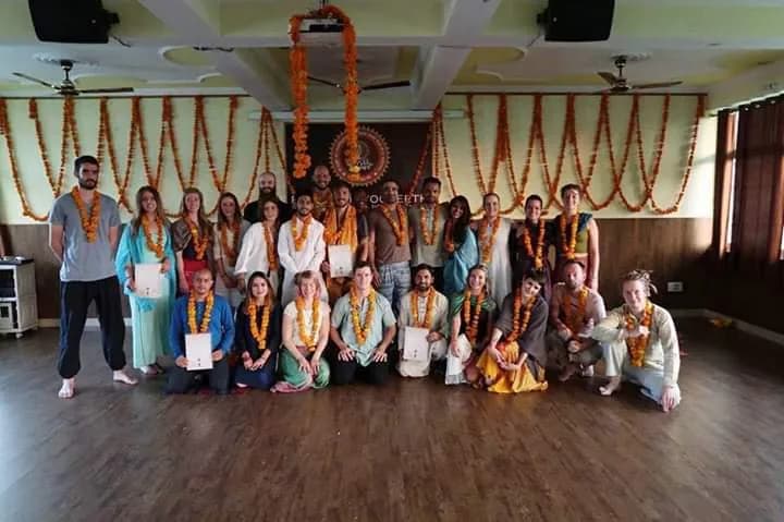 Deep Yoga teacher training graduation ceremony with marigold garlands and certificates inside the Tapovan shala